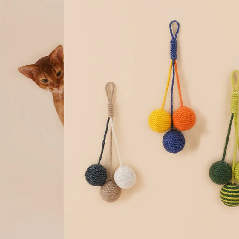 Four-piece cat toy set with teaser stick, catnip ball, and self-play toys on blue background