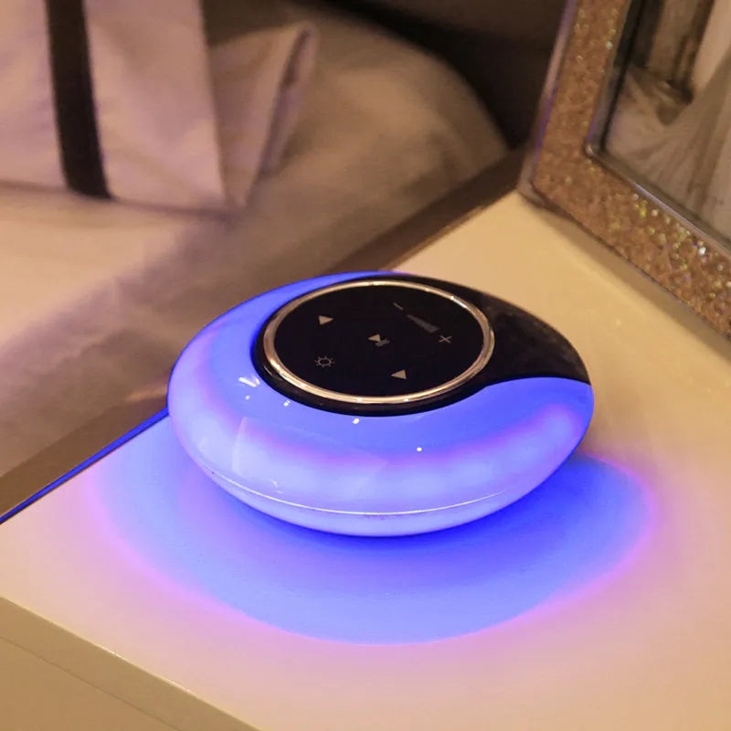 Blue foldable Bluetooth desk lamp speaker with touch controls for dimmable LED lighting.