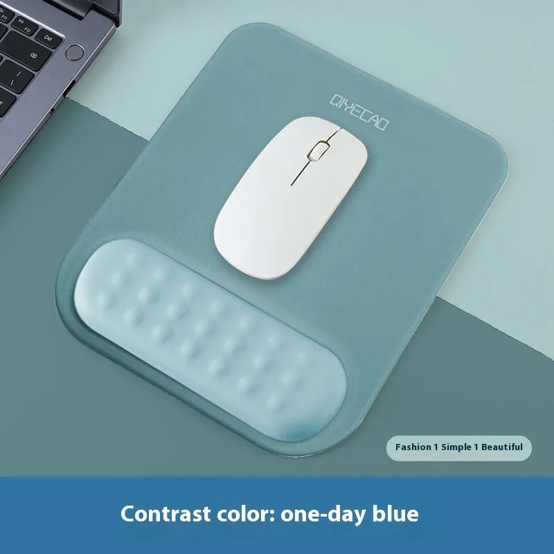 Ergonomic mouse pad with raised wrist support in cloth silicone material showing colour options