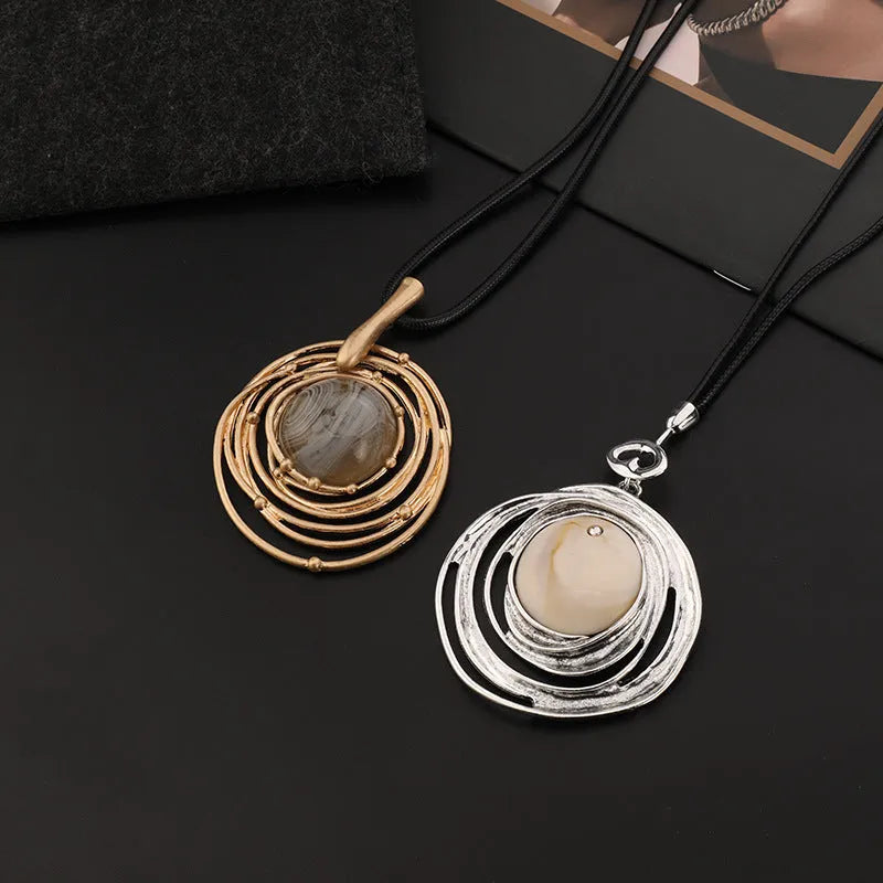 Vintage women's geometric sweater chain necklace with gold alloy pendant and snakeskin wax rope chain.