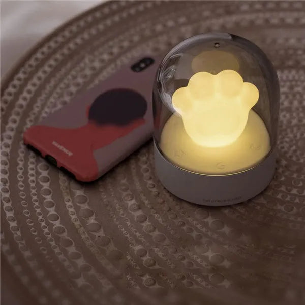 Grey and pink cat paw shaped USB rechargeable night light with musical functions