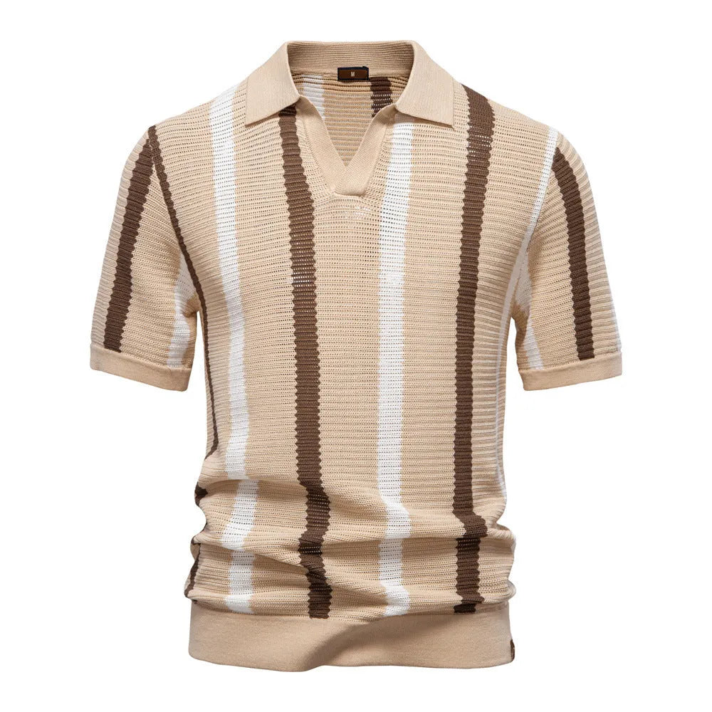 Man wearing a striped light blue short-sleeved polo shirt with a mosaic pattern detail.