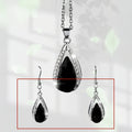 Teardrop pendant necklace and earrings suite with water droplet design in alloy