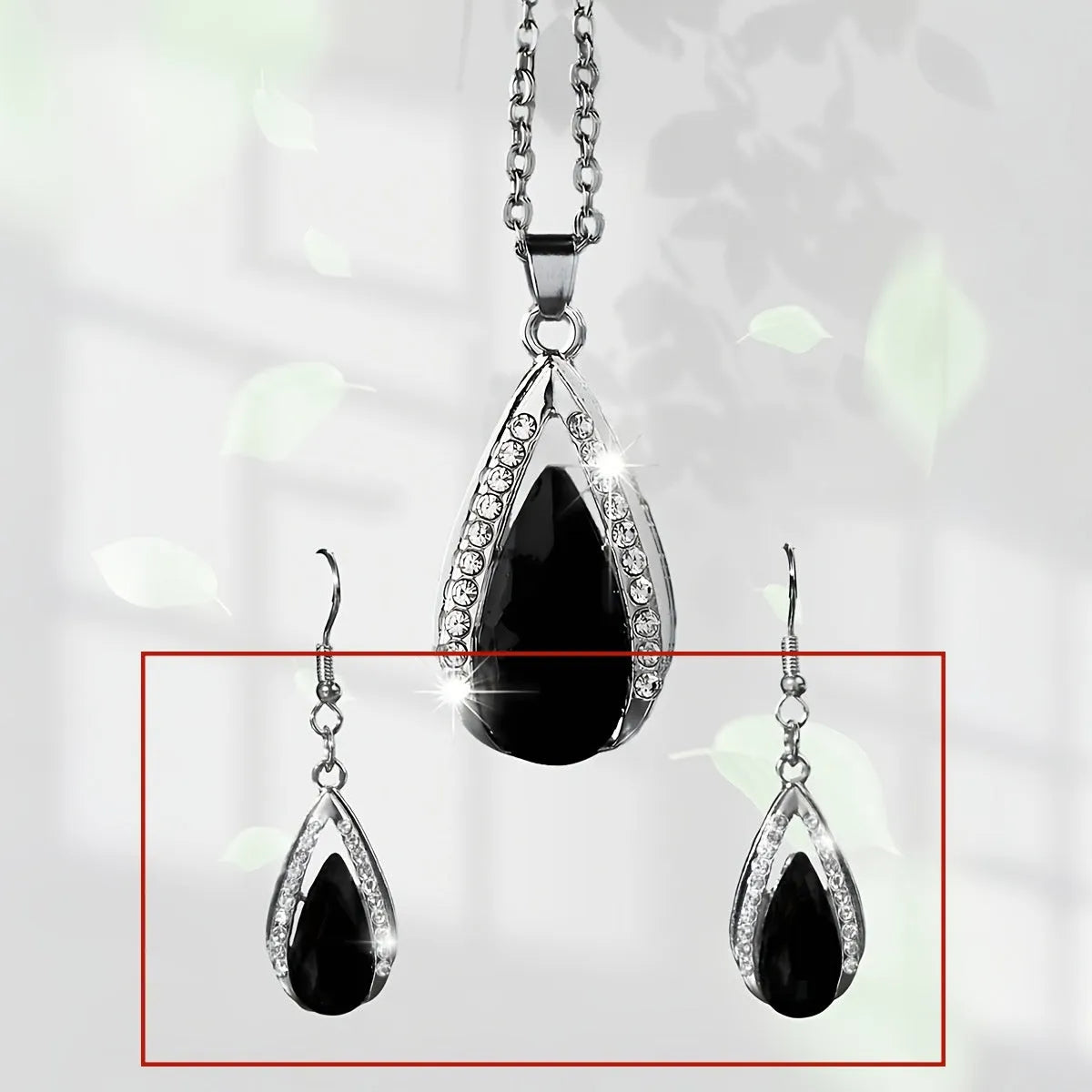 Teardrop pendant necklace and earrings suite with water droplet design in alloy