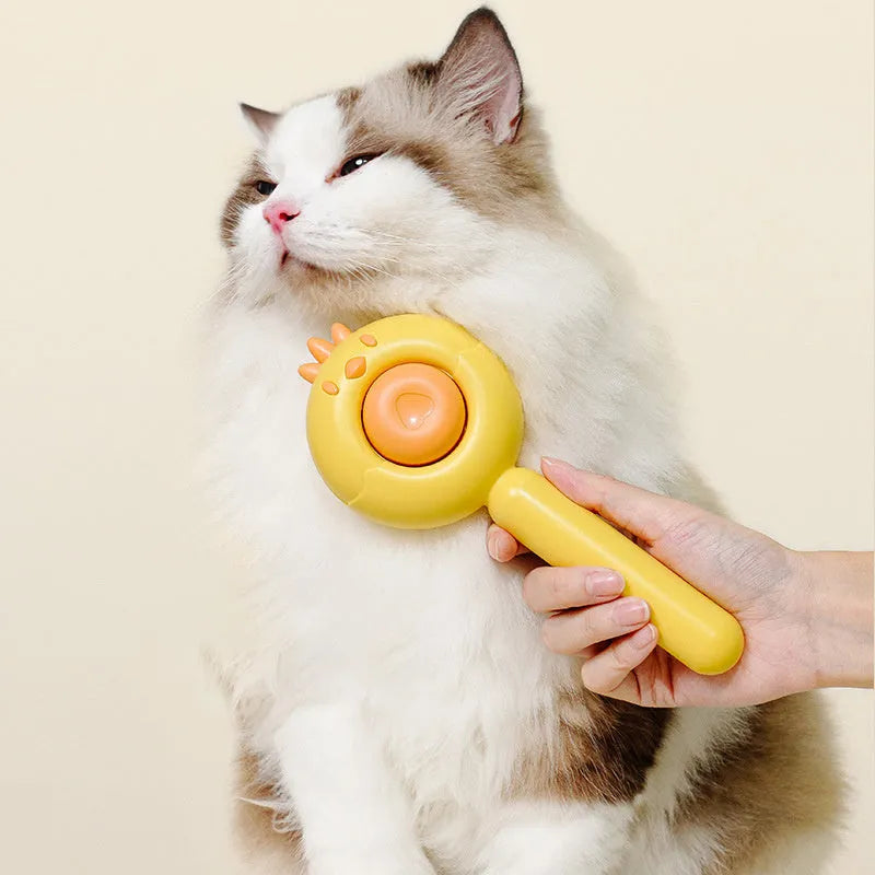 Purple pet grooming brush with stainless steel bristles and a self-cleaning button on a white background.