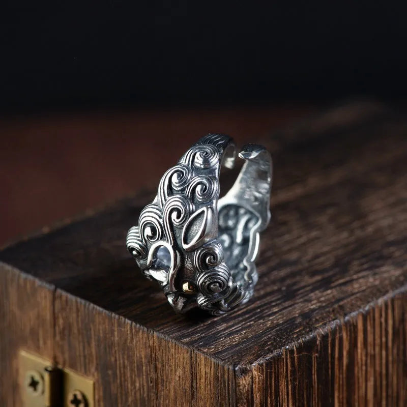Personalised silver open ring with a diamond-patterned jibeast or animal zodiac design.