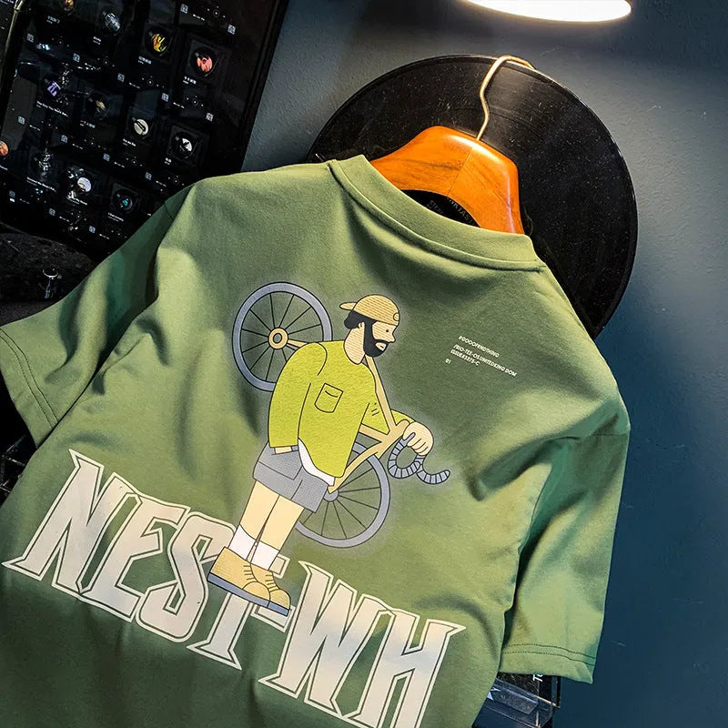 Green men's oversized t-shirt with a printed graphic design and short sleeves on a hanger