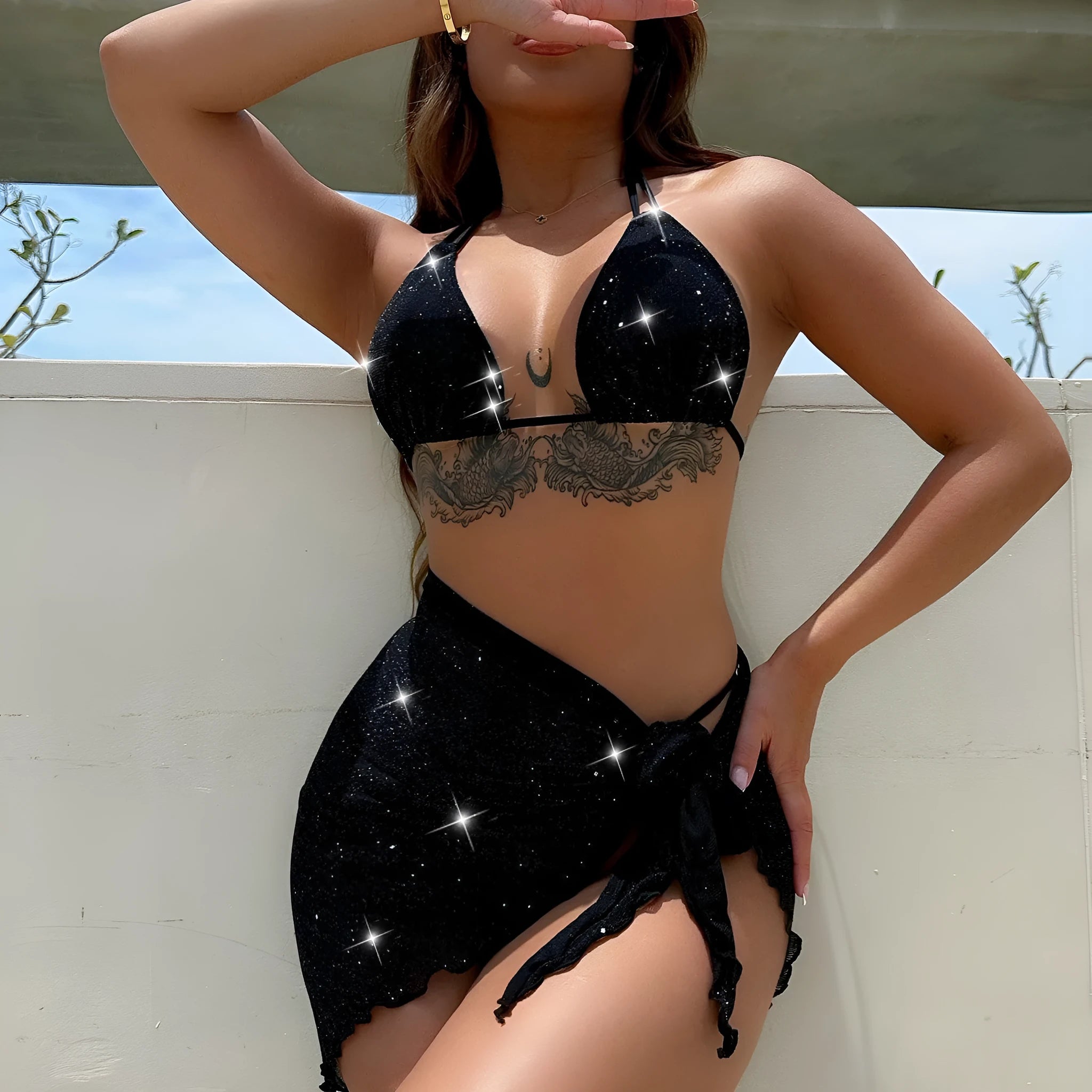 Black three-piece bikini swimsuit set with separate top and shorts on mannequin
