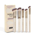 MAANGE apricot coloured five-piece angled blush and kabuki makeup brush set.