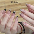 Set of sweet girl theme fake nails with colourful glitter and crystal decorations on a soft gel base.