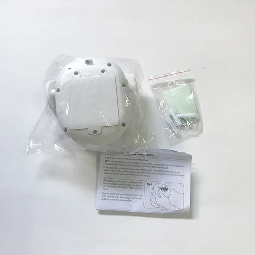 White Atomic Angel induction night light with compact rectangular design and touchless activation sensor