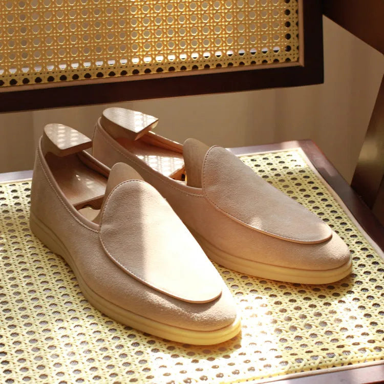 Men's handmade brown leather loafers with a low cut and textured TPR sole.