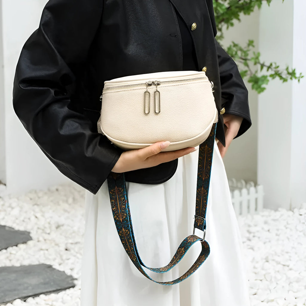 Women's saddle-shaped messenger bag in PU leather with single shoulder strap and sandwich pocket