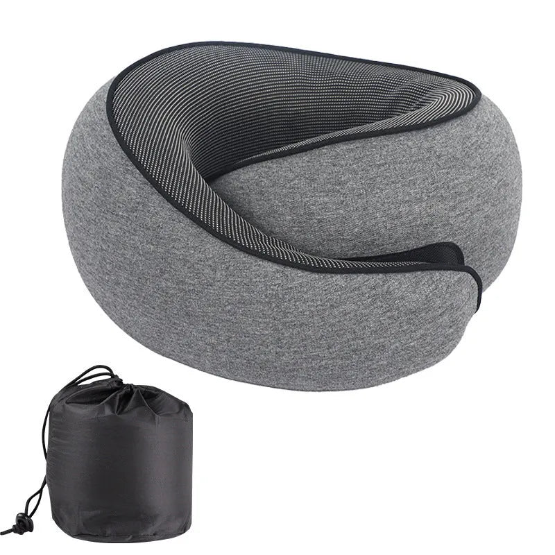 Dark grey U-shaped memory foam neck pillow shown with its storage bag.