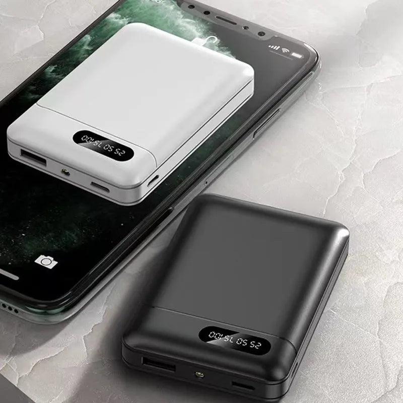 Black and white portable power bank with multiple capacity options and USB ports on a grey background.