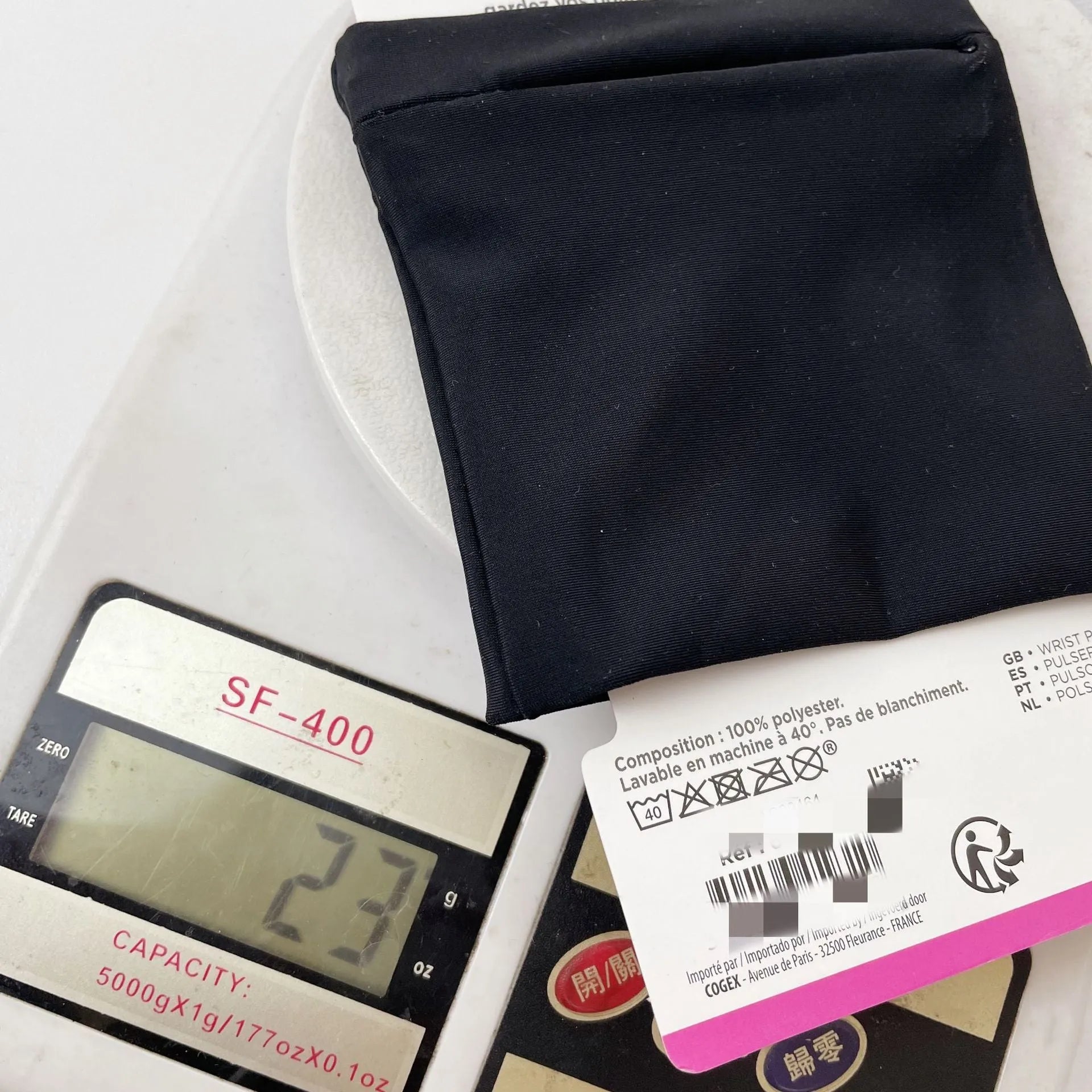 Grey wrist bag armband sleeve for mobile phone, shown with dimensions 10cm by 10.5cm.