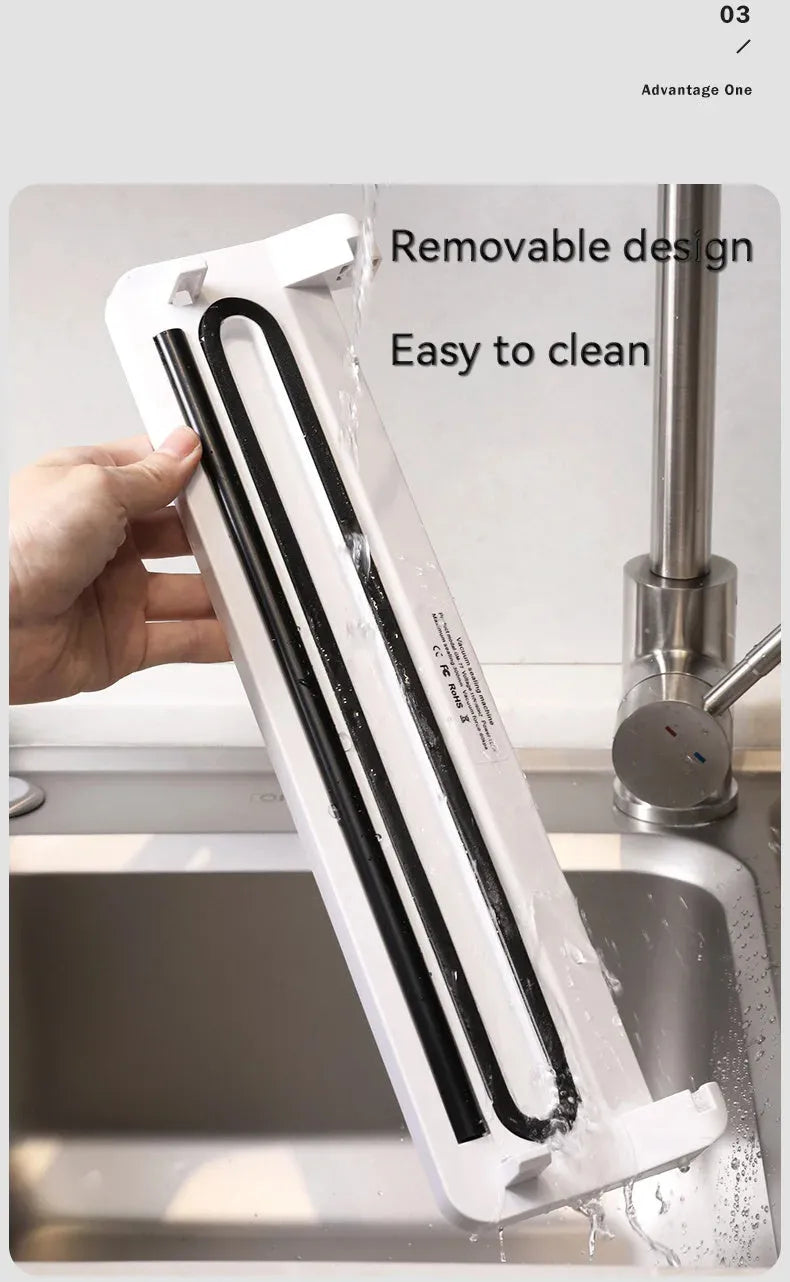 Compact black automatic vacuum sealer machine for household food preservation and item protection