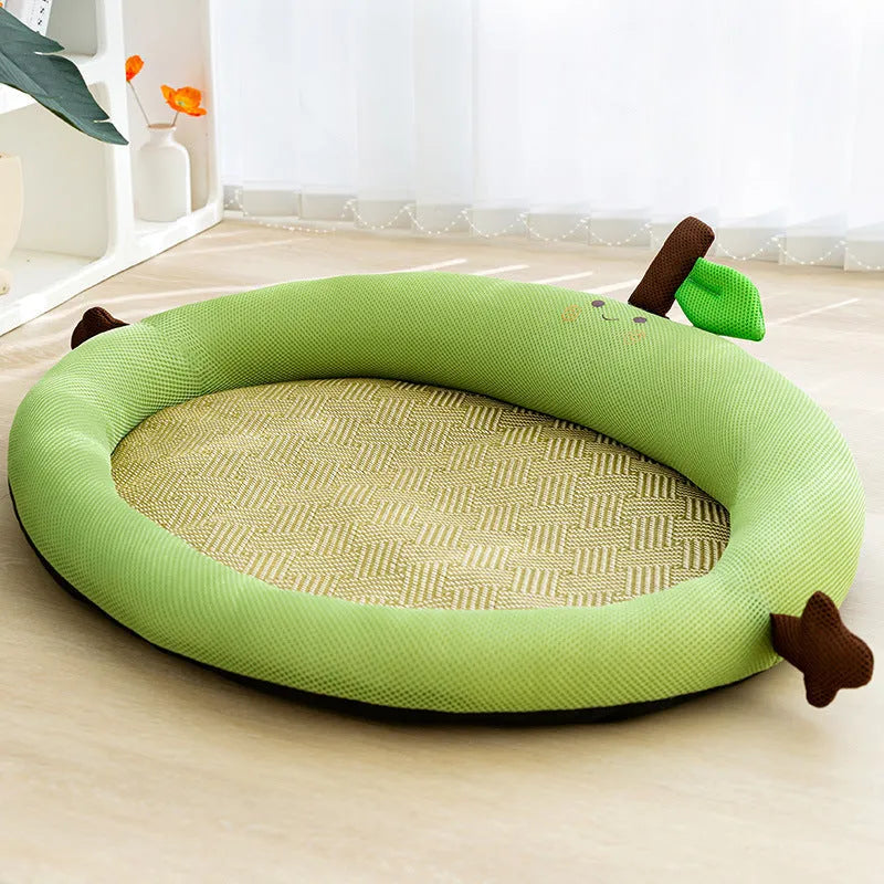 Green large pet bed nest with a raised fruit-shaped backrest for dogs on a wooden floor.