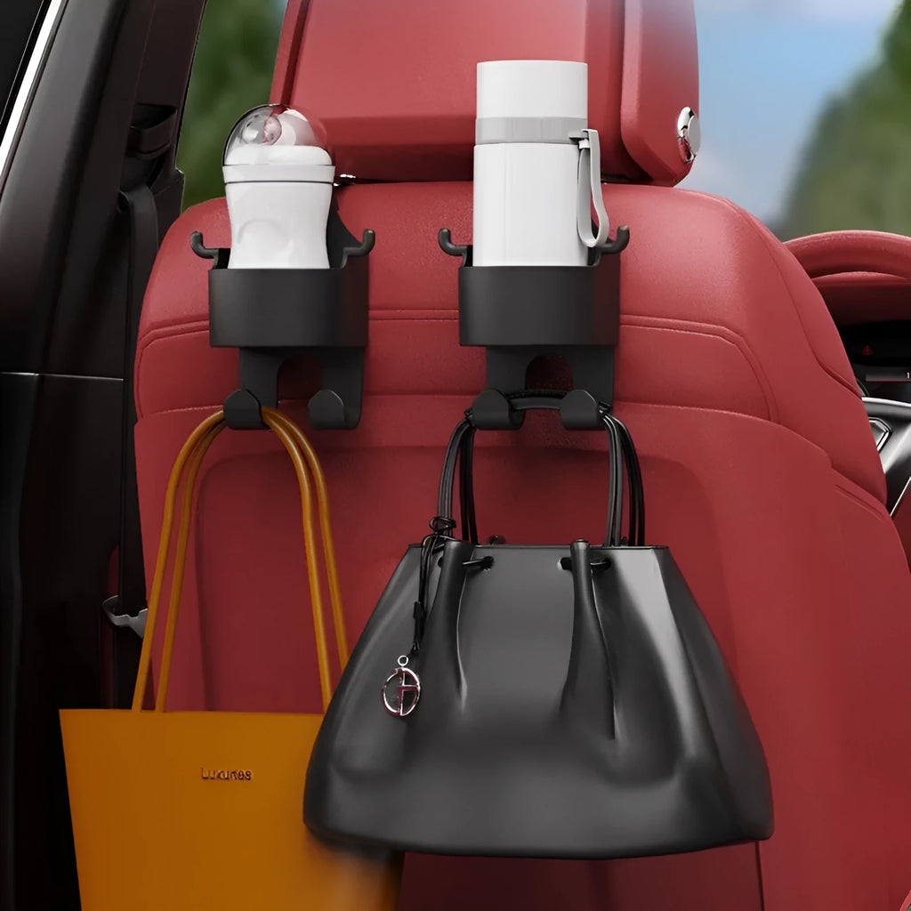 Black plastic car seat back organiser with cup holder and hook, mounted on a car headrest.