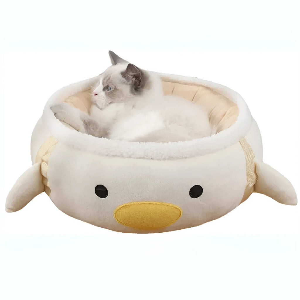Green dinosaur and chick shaped cat bed that can be used flat or hung as a hammock