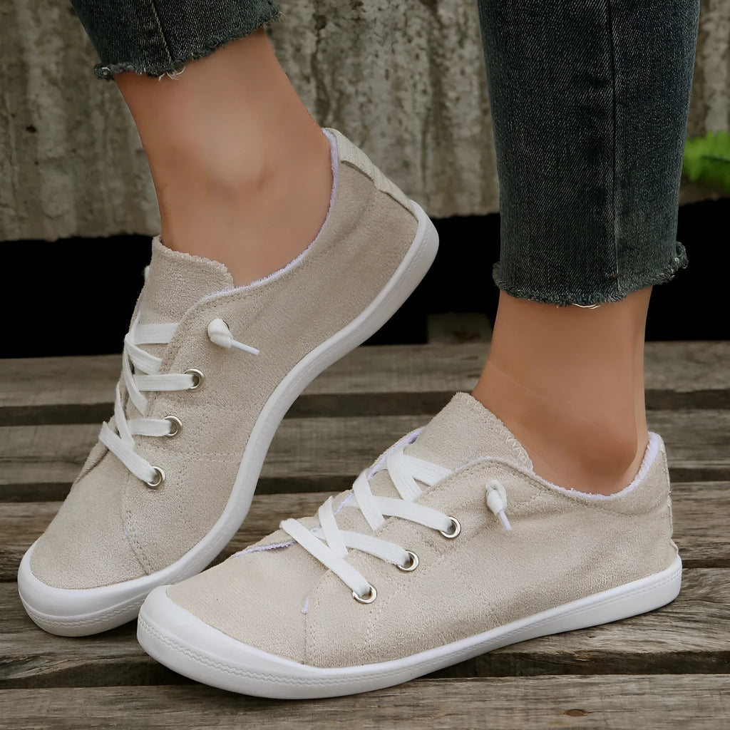 Women's creamy-white beige low-top fabric casual sneakers on a wear-resistant rubber sole.