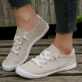 Women's creamy-white beige low-top fabric casual sneakers on a wear-resistant rubber sole.