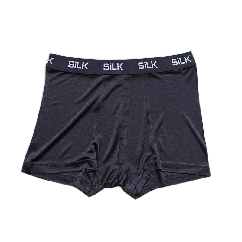 Men's casual silk shorts in navy blue, shown with a loose fit and mid waist design