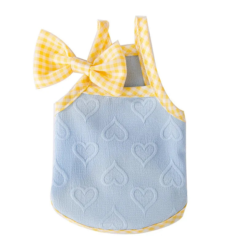 Small dog wearing an elastic heart relief texture bow suspenders vest in Bondi Blue