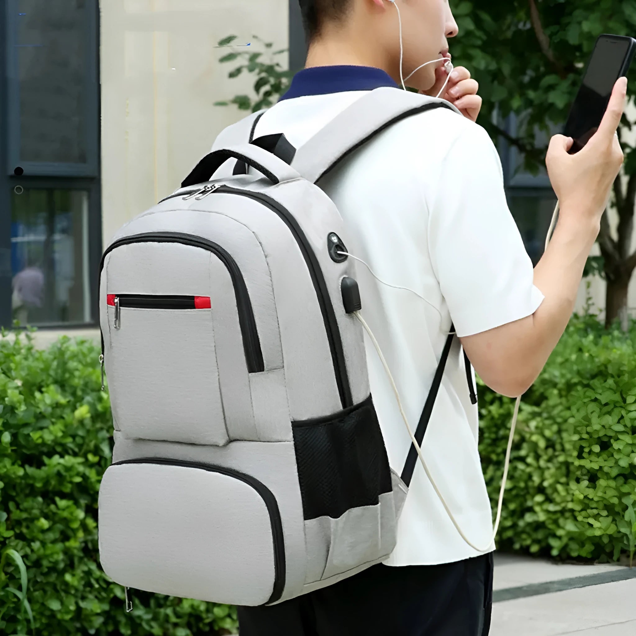 Oxford cloth insulated backpack shown in light grey, featuring curved shoulder straps and a pull-rod belt accessory.