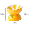 Ceramic raised cat bowl with tilted design and colourful fruit pattern