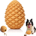 Yellow pine cone-shaped natural rubber dog chew toy with textured surface and treat dispenser hole.