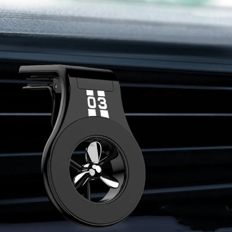 Black magnetic car air vent phone holder with adjustable angle and built-in perfume diffuser.