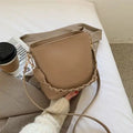 Retro-style khaki PU underarm bucket bag with a woven pattern and a crossbody strap.