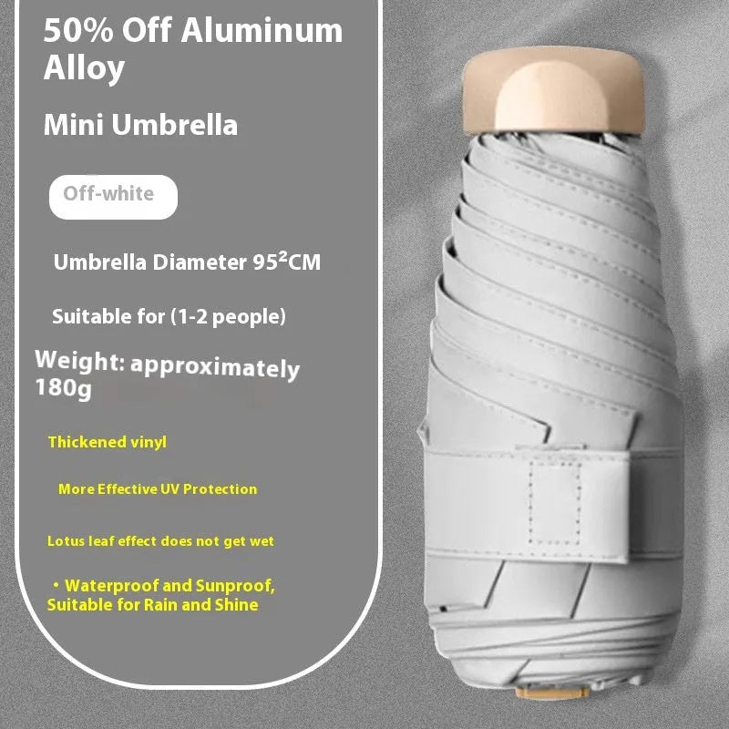 Closed five-fold manual umbrella showing one of eight colour options: beige, black, blue, dark green, navy blue, pink, yellow, or purple.