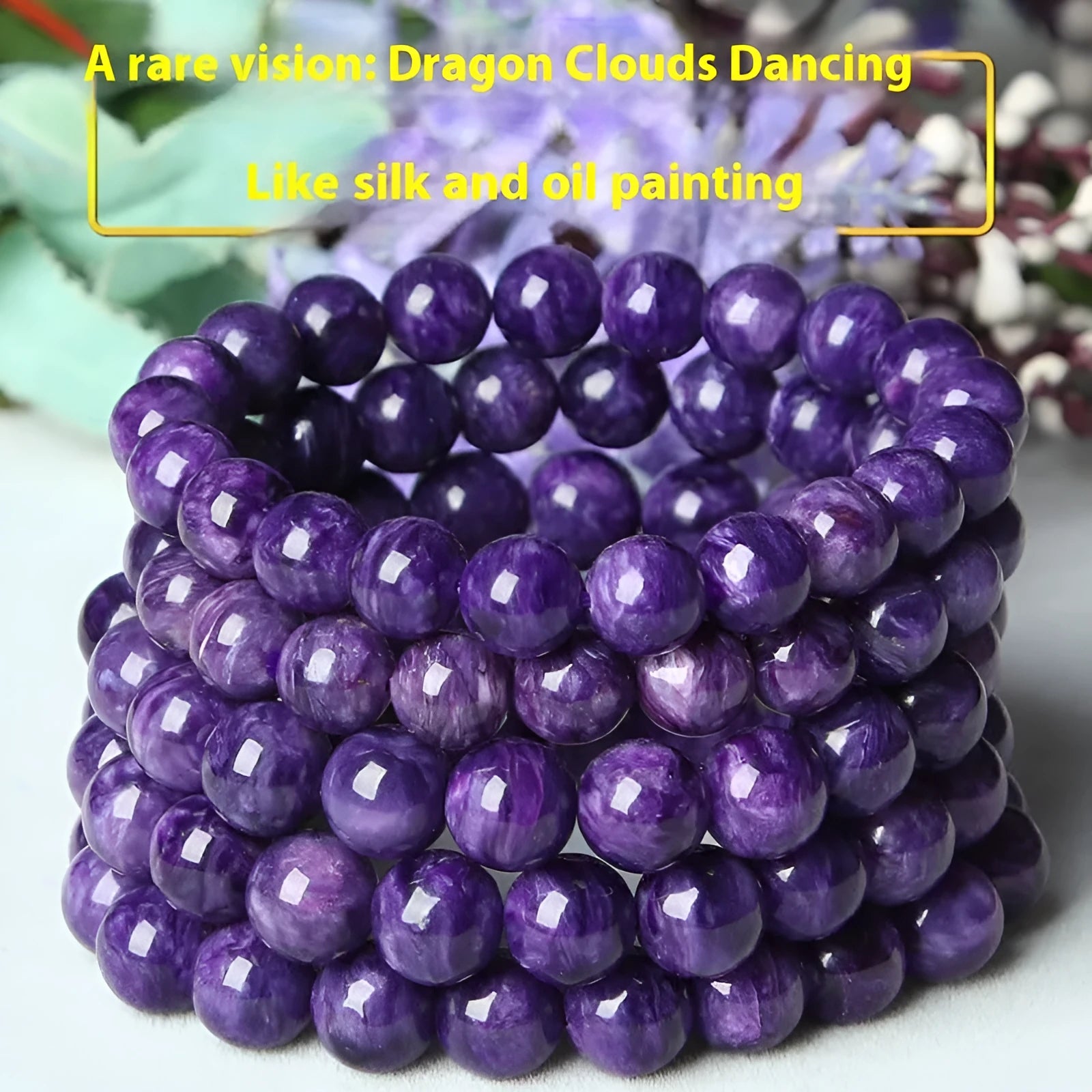 Natural transparent charoite crystal bracelet with platinum elements on a wrist.