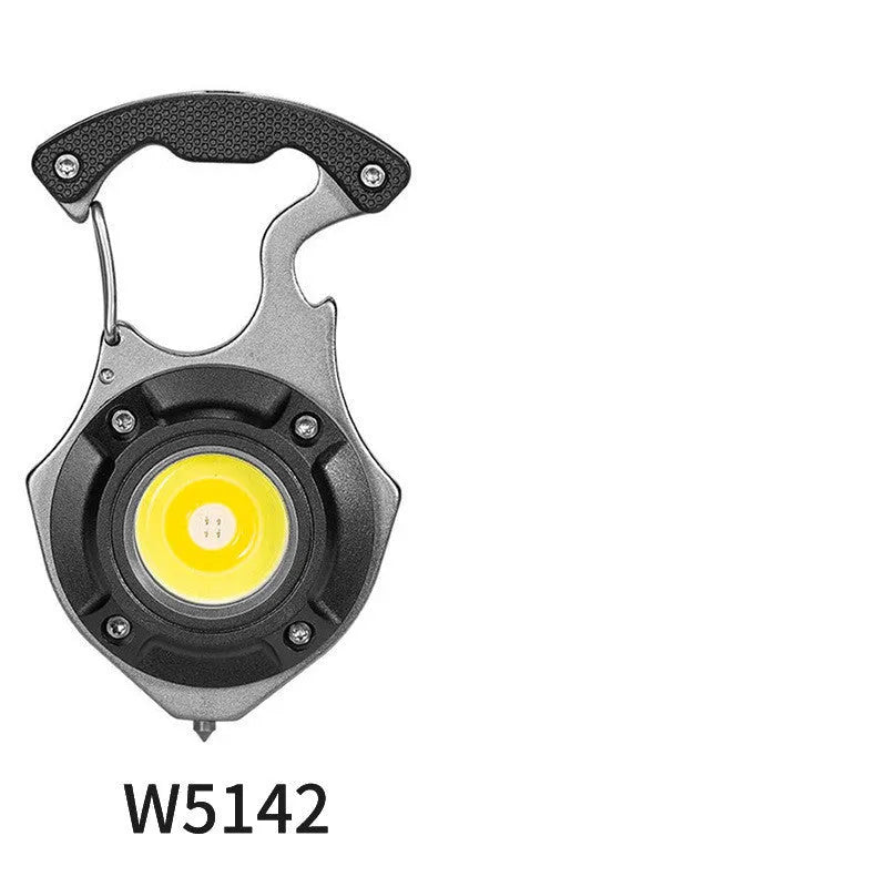 Compact silver and black multifunction keychain torch with window breaker tip and seven LED light modes.