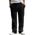 Man wearing loose-fit high-waisted straight-leg casual trousers in khaki colour.