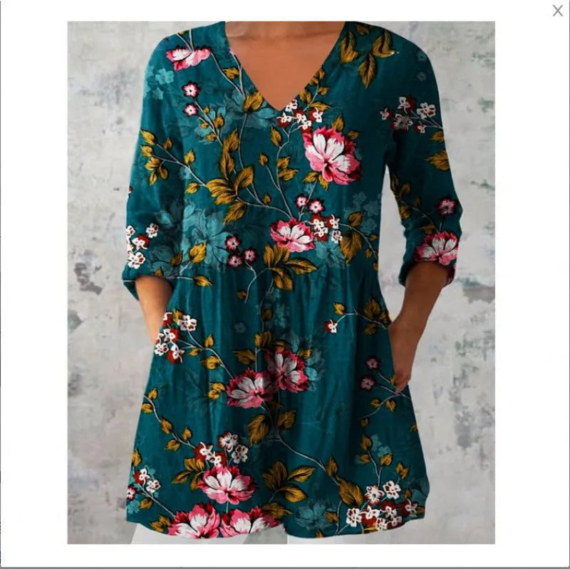 Women's floral printed loose dress with wide waist and three-quarter sleeves on a hanger.