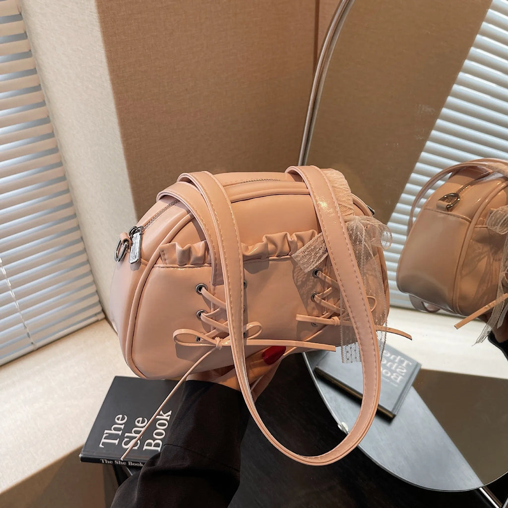 Women's fashion handbag with bandage bow design and mobile phone compartment in selected colour
