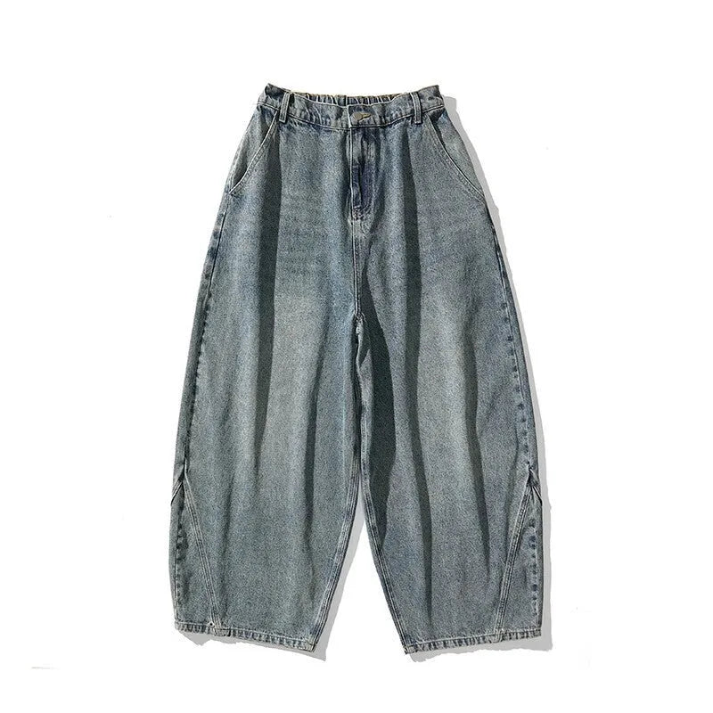Men's plus size light blue wide leg baggy denim jeans with a low waist and straight leg opening.