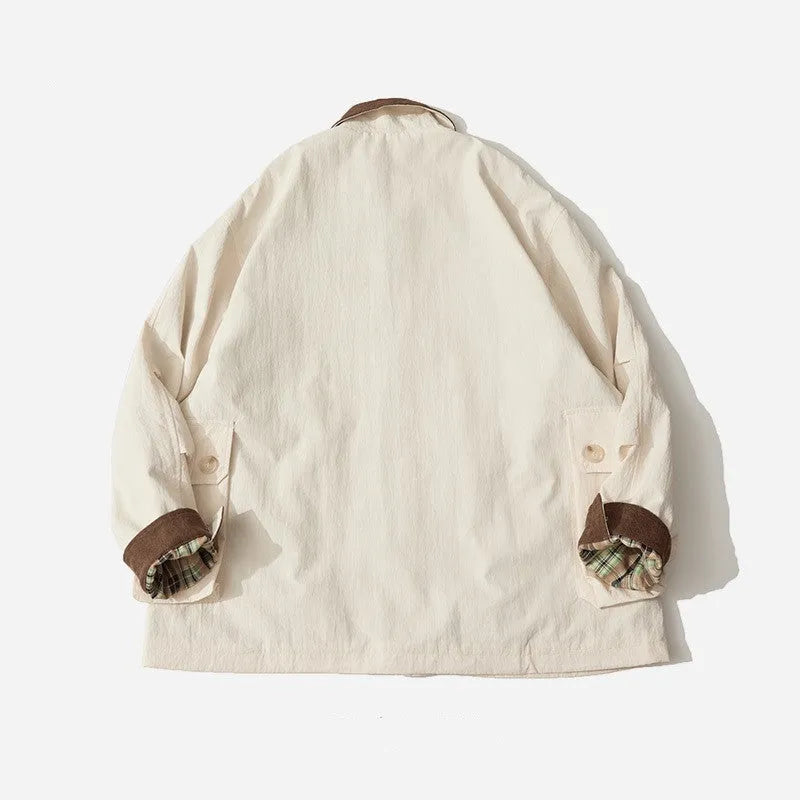 Green and apricot unisex casual jacket with contrast colour blocks and side seam pockets.