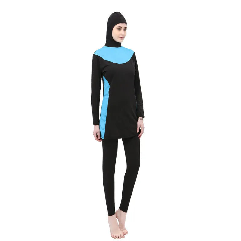 Conservative long-sleeved hooded two-piece swimsuit for women in black with coloured accents.