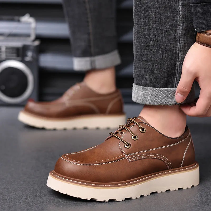 Men's black retro low-top Martin boots with a round toe and non-slip rubber sole.