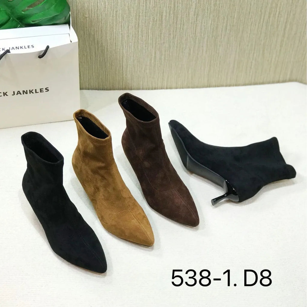 Black pointed toe women's ankle boots with a stiletto heel on a white background.