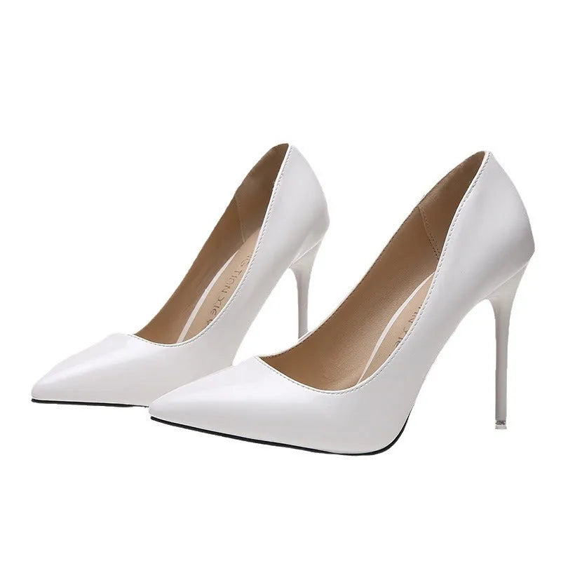 Women's apricot nude pointed toe stiletto high heel pumps on a white background.