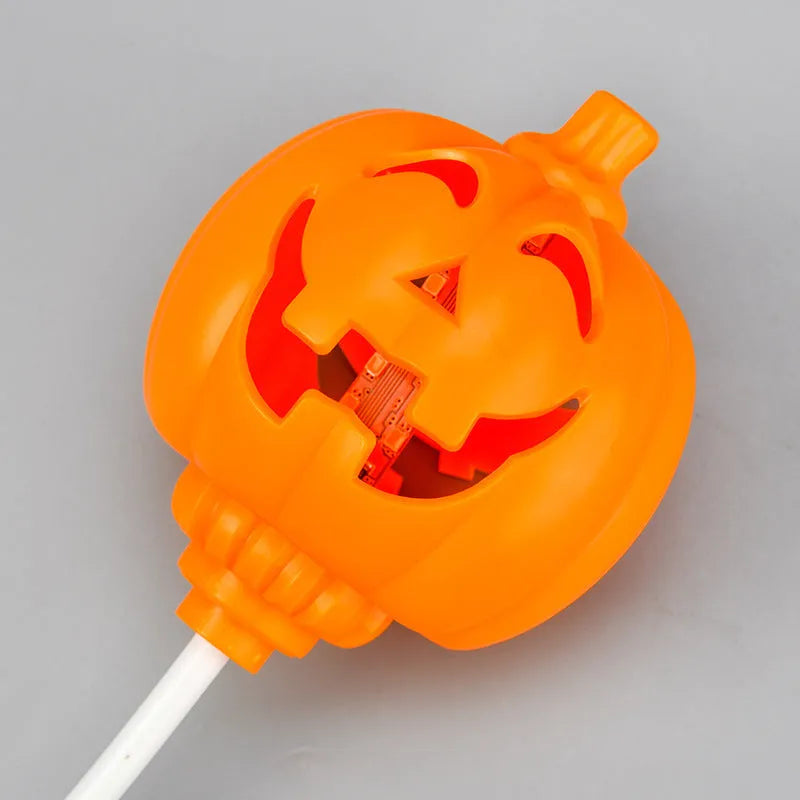 Plastic pumpkin lamp with USB port showing yellow and purple light options