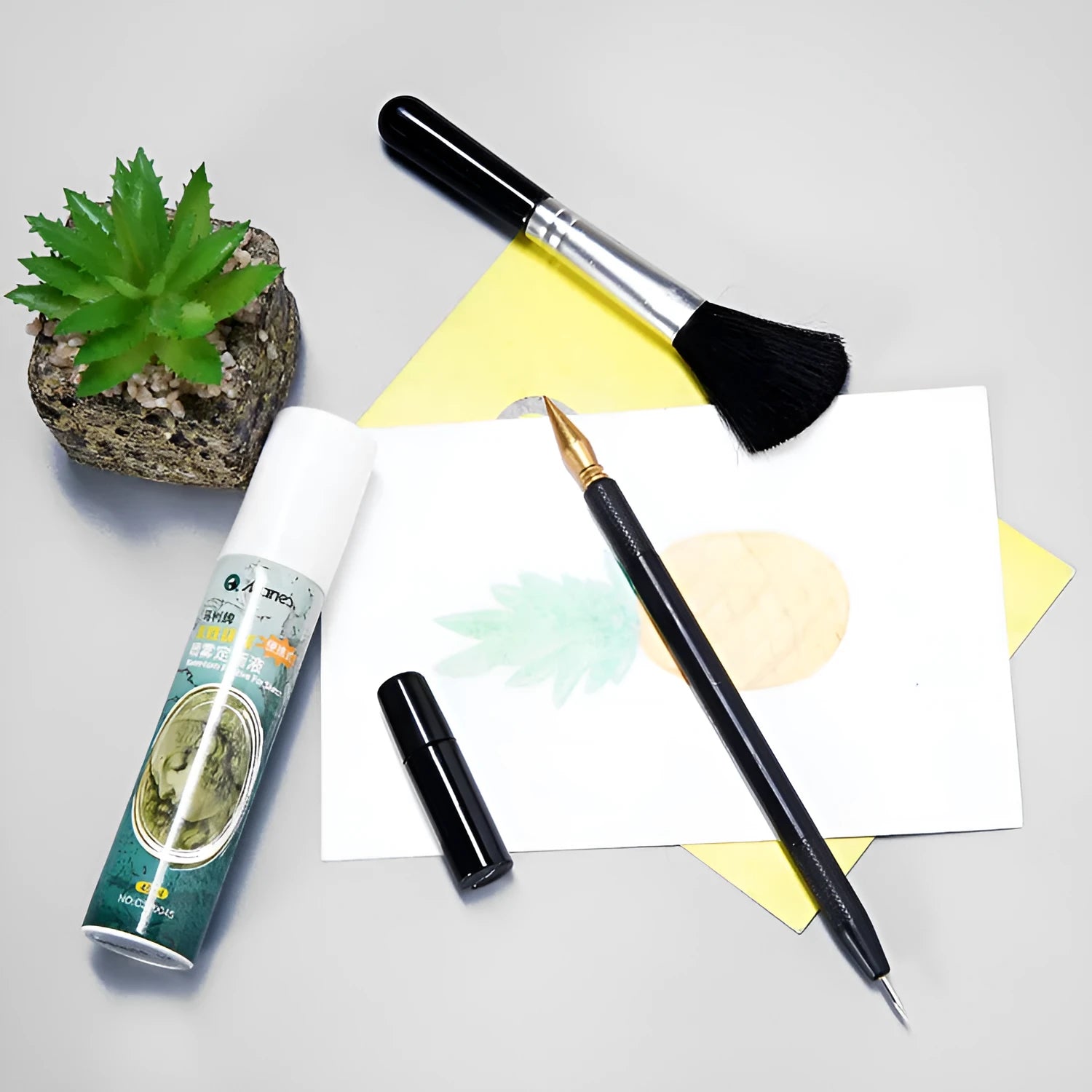 Scratch painting repair tool kit showing scratching pen, repair solution bottle, brushes, and bamboo sticks on a craft table.