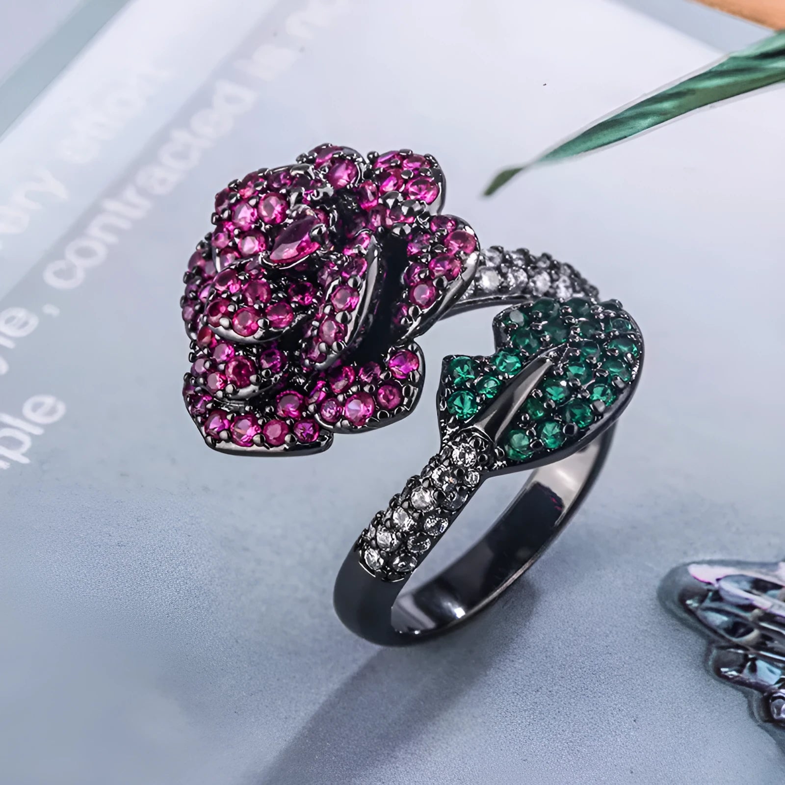 Women's black gold geometric ring with gold-plated red corundum flower detail