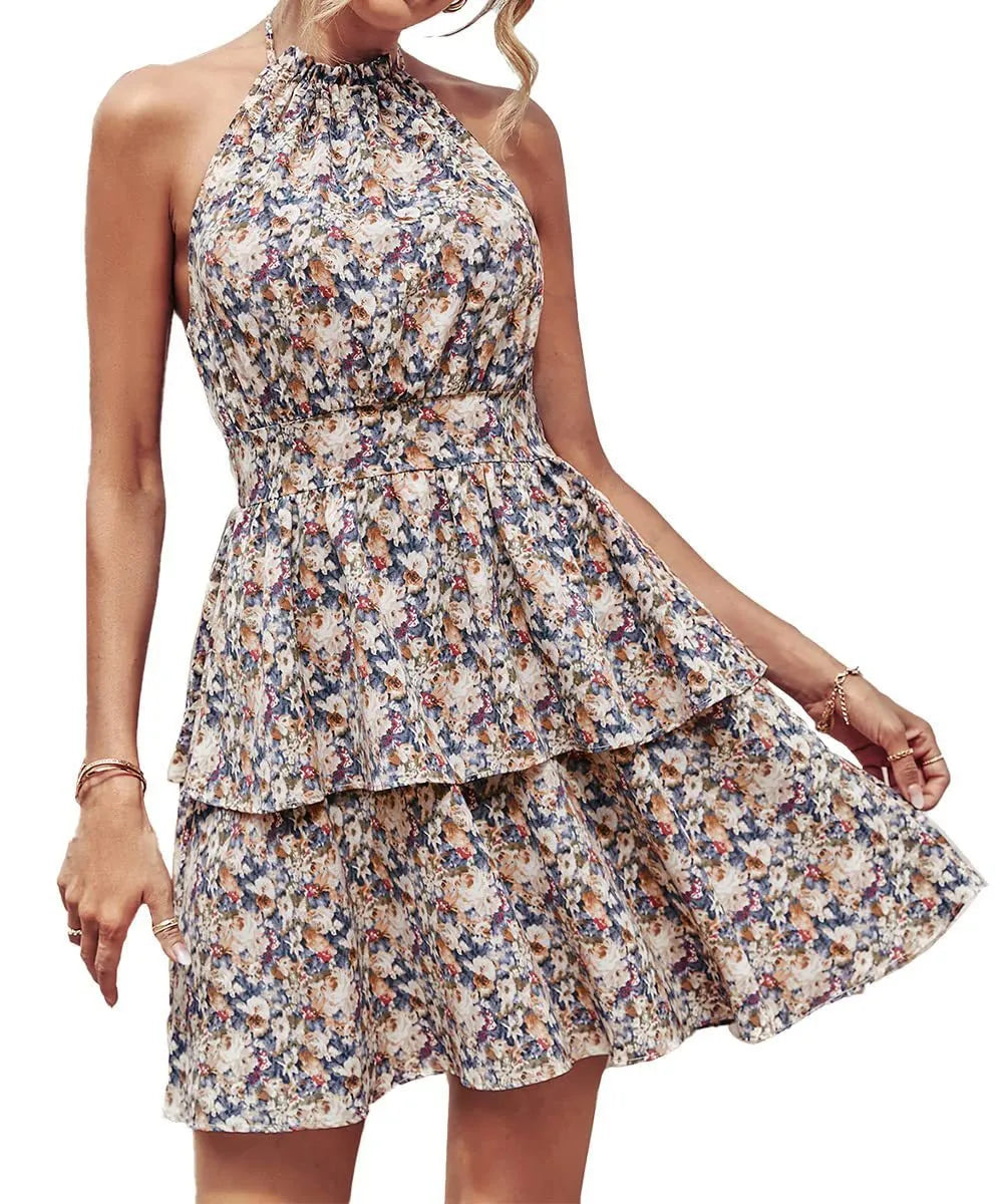 Woman wearing a backless halter neck A-line summer dress with boho ruffled print.