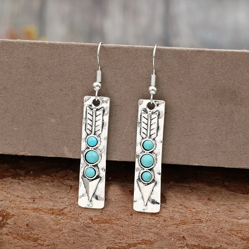 Silver geometric earrings with turquoise inlay in long strip retro design
